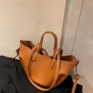 Polene Camel colored lychee cowhide handbag